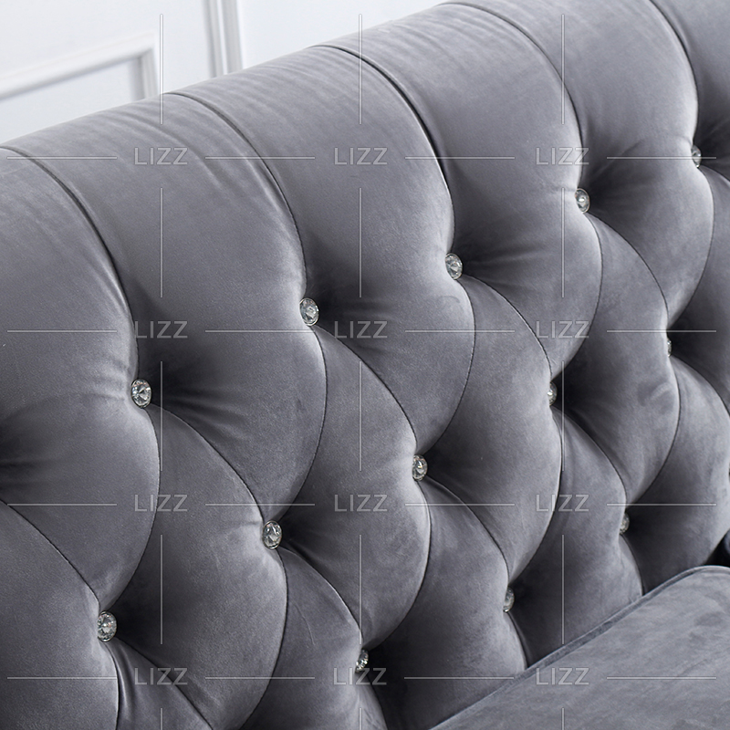 Canapé d'angle en tissu gris fleur avec coussins